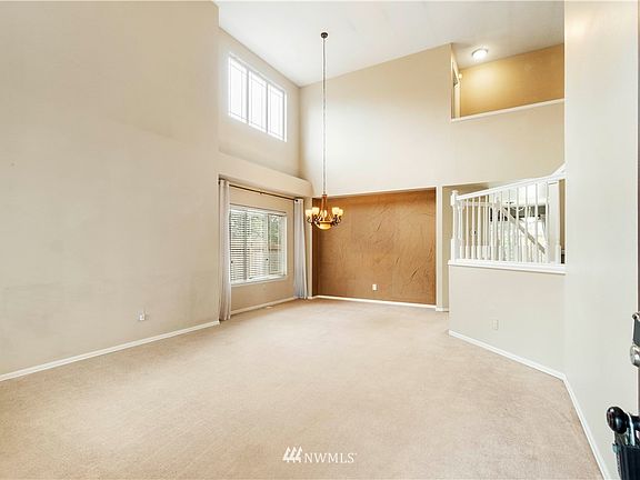 Enter the spacious formal living room and dining room.