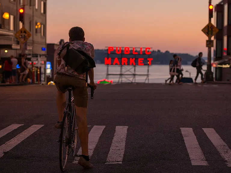 Walk or bike to Pike Place Market to catch sunset over the Sound