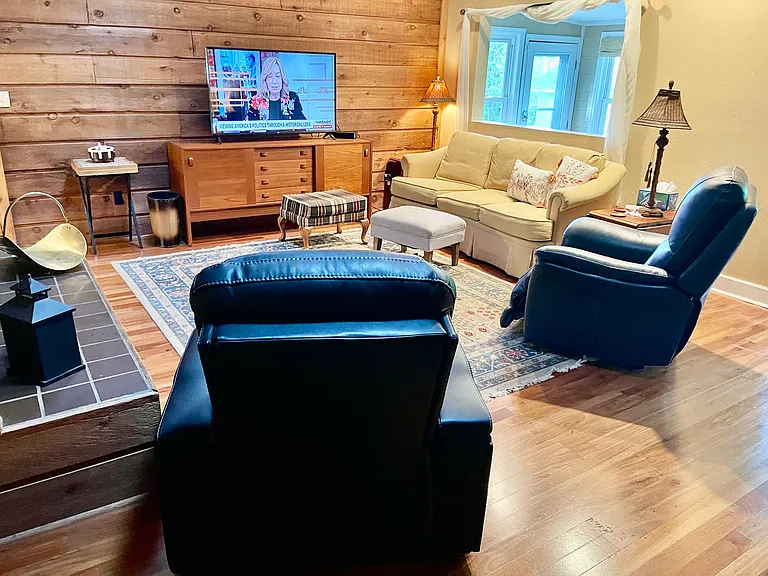 Two comfortable electric recliners.
