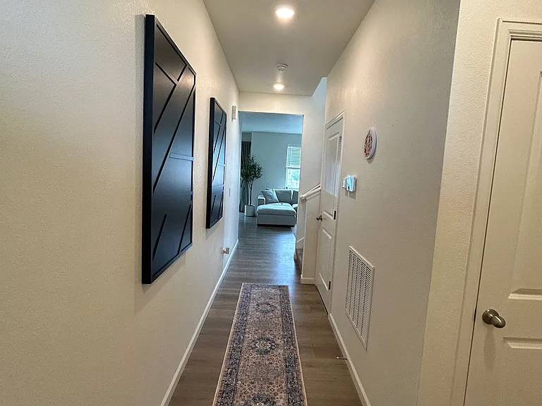 Front entrance hallway heading to the living room