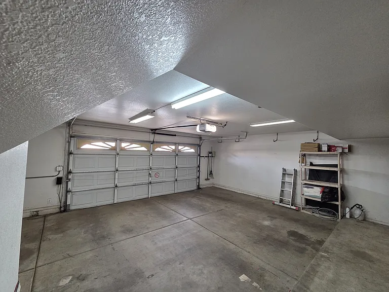 Room 2 Car Garage with actual space beyond the door.
