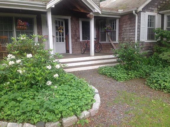 Front porch and main front door; Rhododendron in June