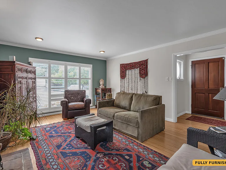 Living room off the entry way to the front door