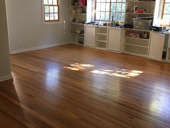Living / Dining Room with Built in Bookshelves and cabinets