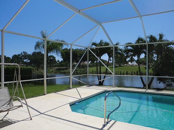 swimming pool with canal and golf view