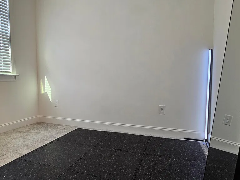 Second bedroom can be used as an office/workout space. Room also features a full bathroom.
