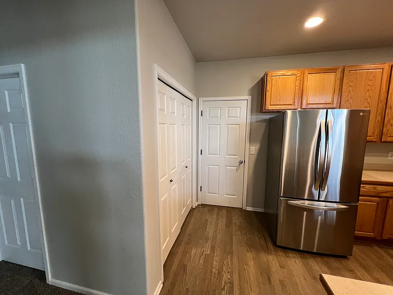 Kitchen with Laundry Closet and Garage Door