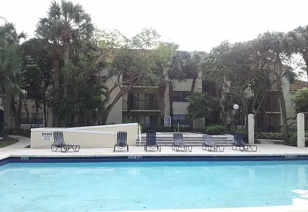 Side view of 1st of two pools. The actual on-site view is MUCH better. There is a BBQ and Jacuzzi .
