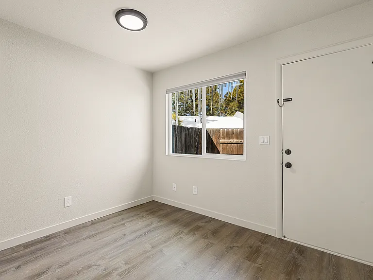Back bedroom and door to backyard.