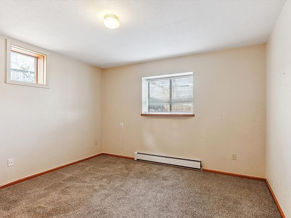 Bedroom with carpet and full closet