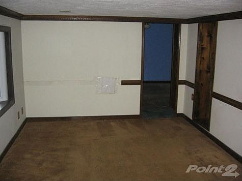 Living room has wood stove flue