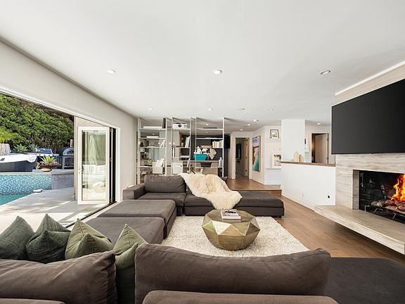 Adorned with an elegant marble fireplace.