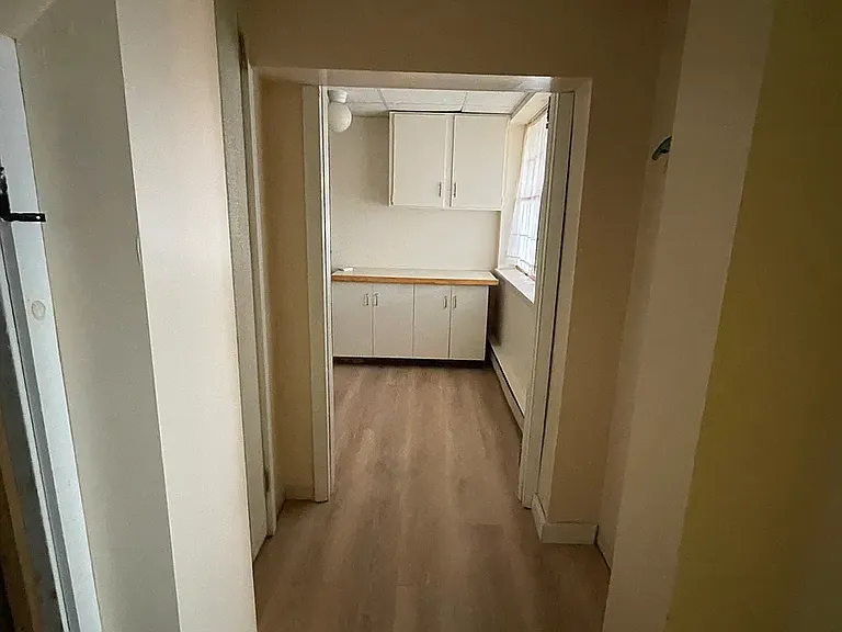 Basement mudroom attached to heated garage and laundry room. Plenty of storage cabinets for gear