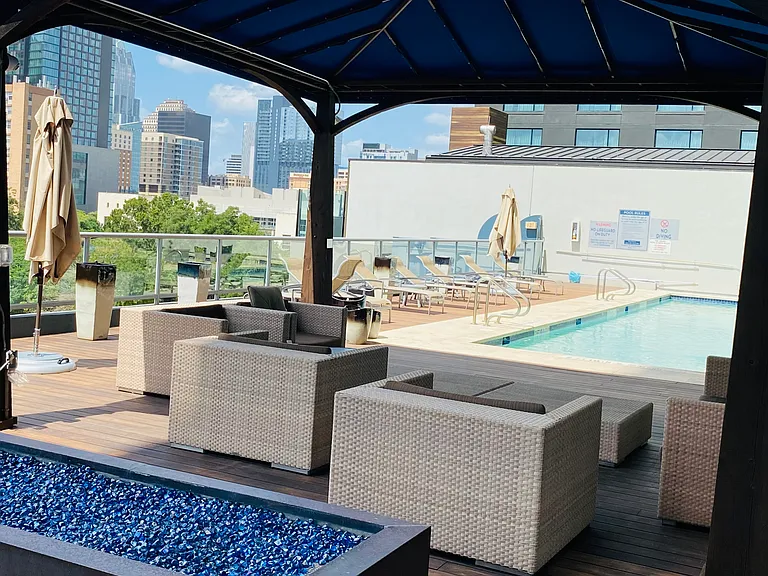 The covered gazebo, firepit and swimming pool are on the amenity deck, which is conveniently located on the same floor as the condo, with easy access via the unit's large, private patio.