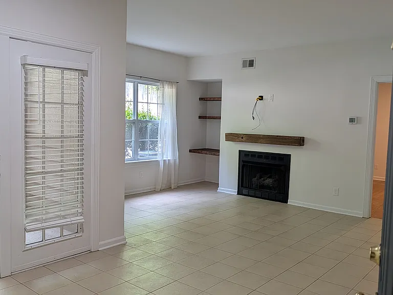 Welcome inside this wonderfully cozy one bedroom condo with a WORKING gas fireplace, tile floors and MORE