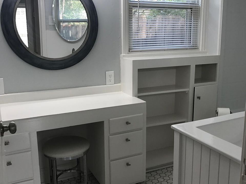 Bathroom with new tile, plus built-in storage and vanity