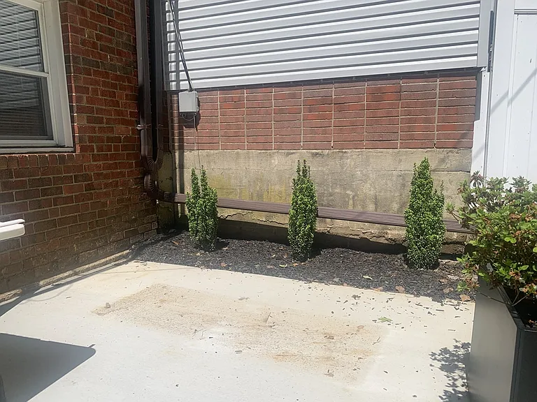 New patio with planters and outdoor furniture