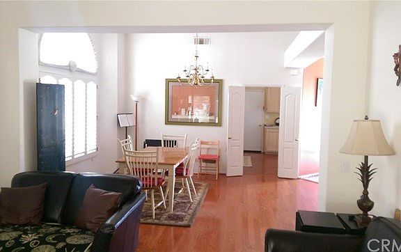 View from living room into dining room with kitchen & breakf
