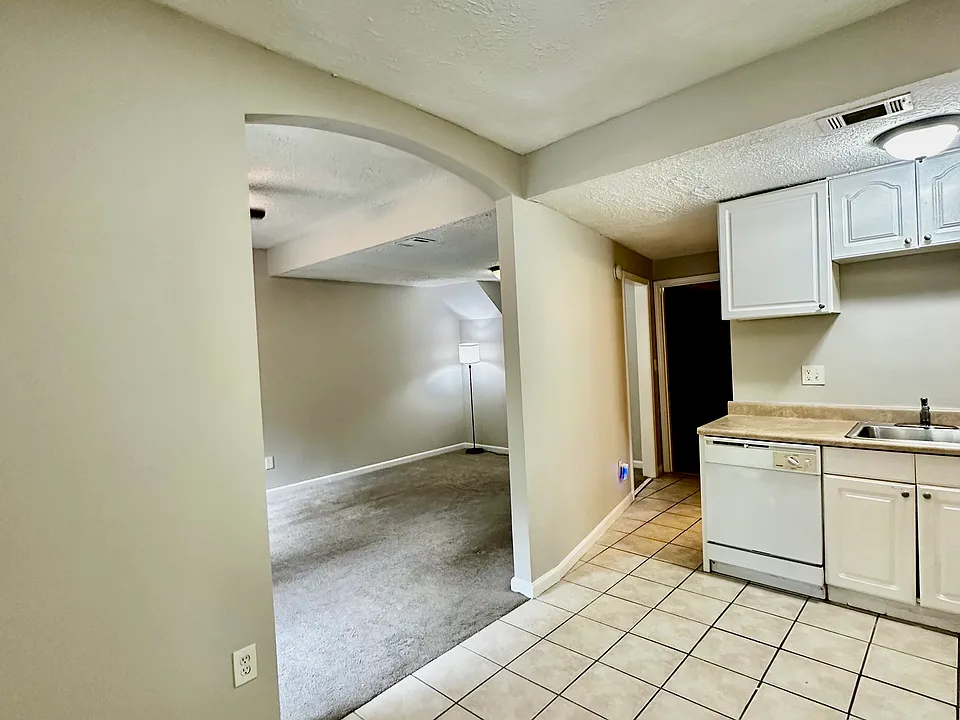 Grand Arched Opening to Living and Dining Areas