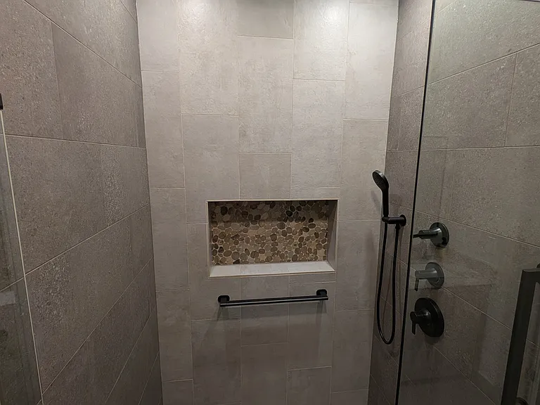 Walk-in shower with heated floor.