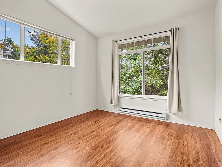 Master bedroom with cathedral ceilings shown from entry door