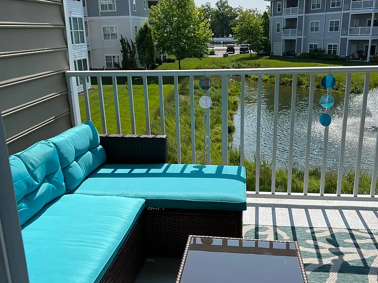 Patio with pond view, accessible from the living area and master bedroom