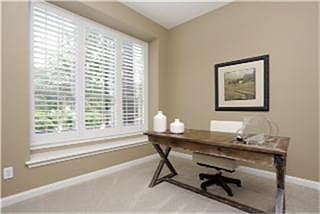 The private study overlooks the professionally landscaped front yard. The Seller has replaced the ca