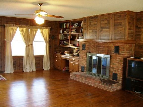Great room with fireplace and built-in shelves