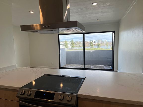 Looking at the beautiful view while cooking with the new five-top range with oven and stainless hood.