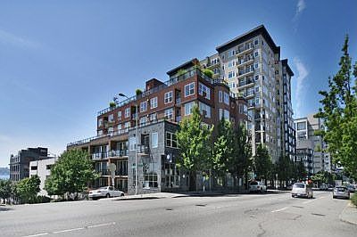The Vine Condominium a concrete and steel building with secure garage parking and 3 storage lockers!