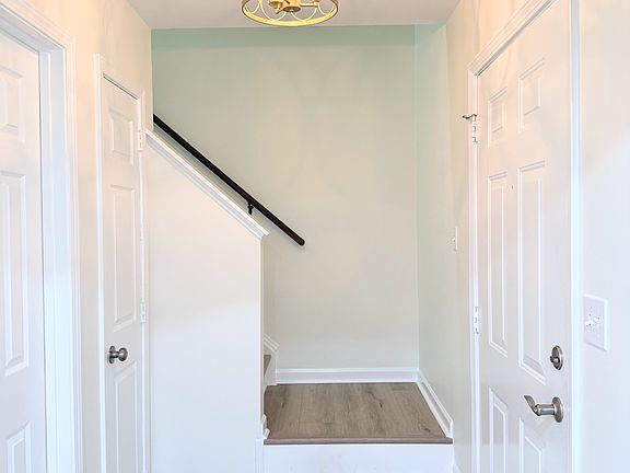 Bright entry hall with powder room and coat closet.