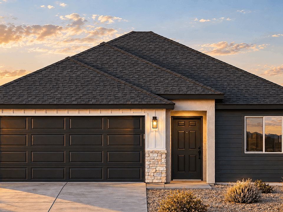 A single-story suburban house with a dark roof, a two-car garage, and a front entrance at sunset.