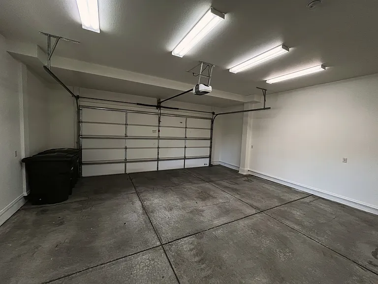 large 2 car garage with extra storage space (inside)