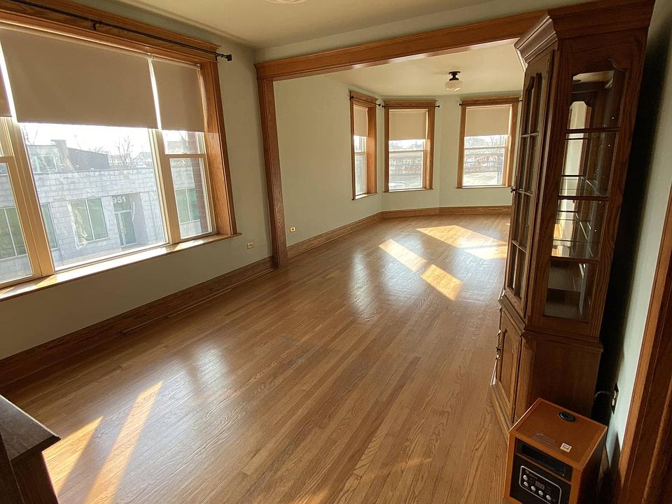 Living Room (21'7"x12'6") and Dining Room (12'2"x12'6") looking South East. Hutch with built-in lighting.
