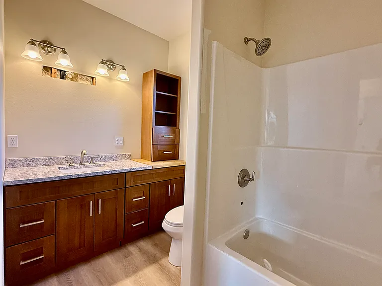 Large main bathroom is spacious. This was during construction and mirrors are up now.