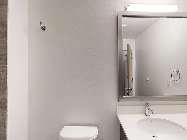 Bathroom with wood-style flooring.