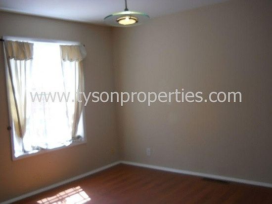 second bedroom w/ wood floors
