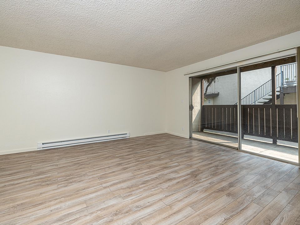 Large Livingroom with oversized sliding glass door.