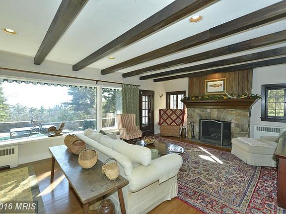 Beamed Ceilings, Hardwoods, Wood Burning Fireplace