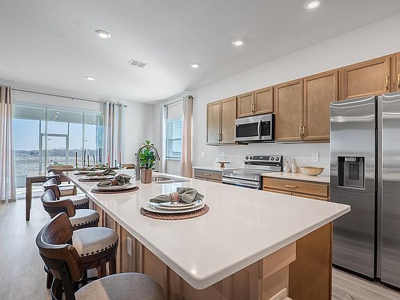 Meals are a delight in your beautiful kitchen with seating at the island and adjacent sunny dining c