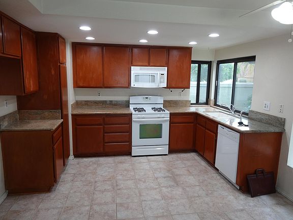 kitchen: granite counter, gas range, microwave,, dishwasher, new lighting, easy to clean ceramic tile floor