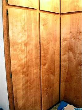 Three sided pantry or storage from floor to ceiling