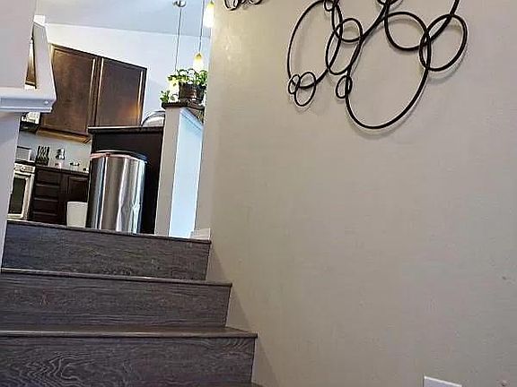 Split level entry to upstairs (living, dining, master bed, 2 baths, laundry)