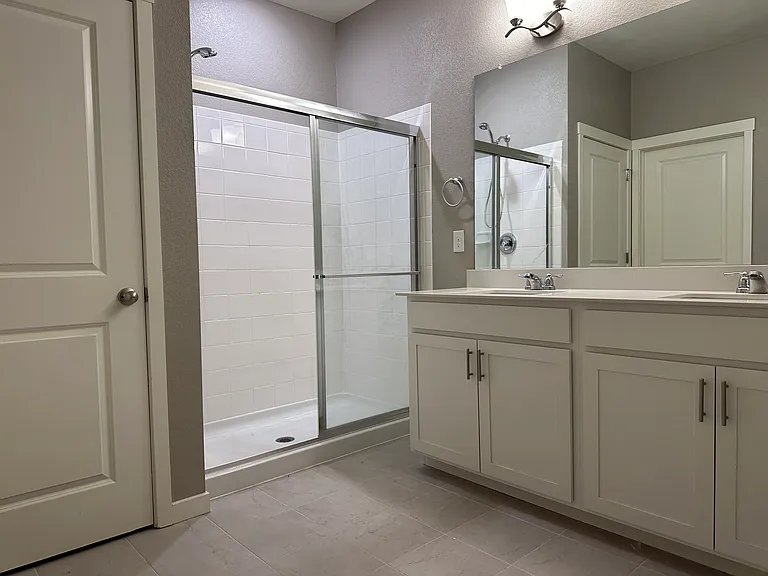 Master bathroom with a separate toilet room
