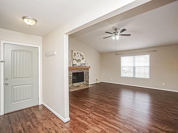Vinyl flooring extends into the main living area from the front door to the den, dining area and hall.