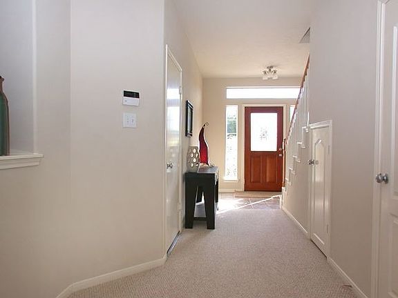 Beautiful upgraded glass door with tile entry. Great storage under stairs!!