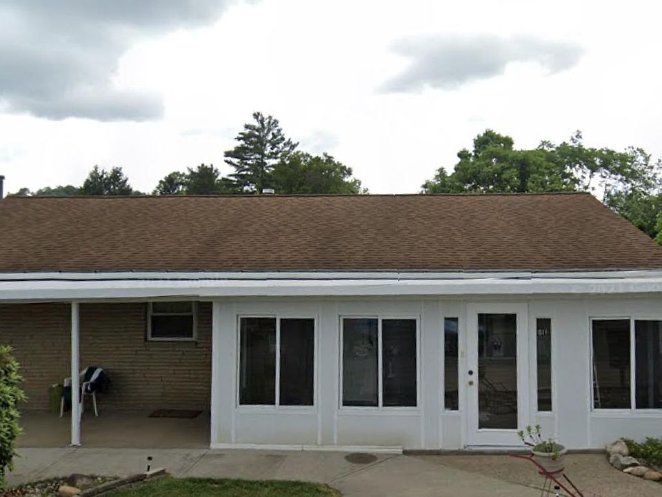 Exterior view of parking and screened in porch
