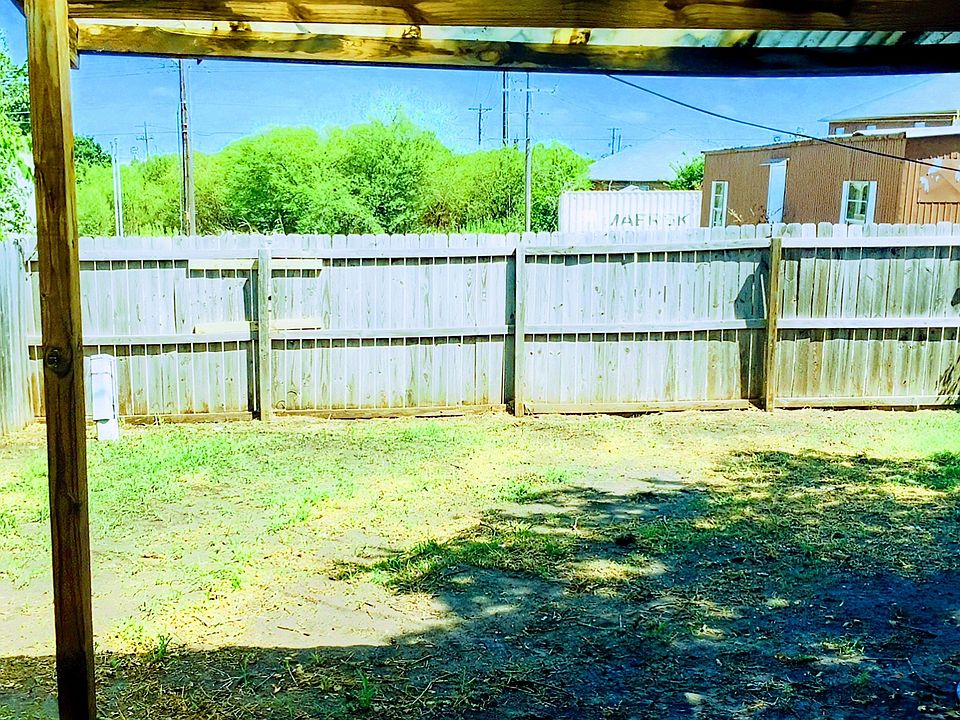 Covered awning out the back door. with private fencing