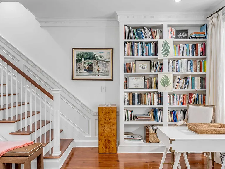 Second floor living room/ office desk ,with staircase to third floor.