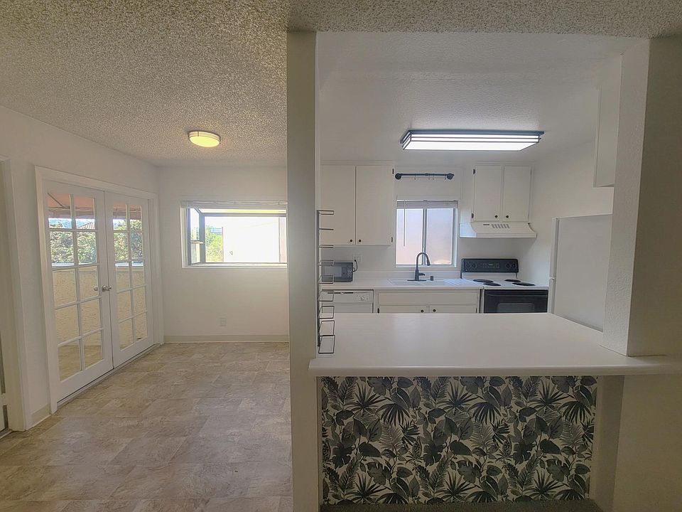 Bar area boasts a statement wallpaper. If not your style, this can be removed.